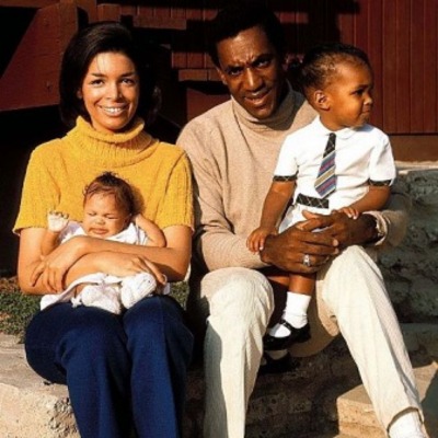 Bill Cosby and Camille Cosby holding their kids.